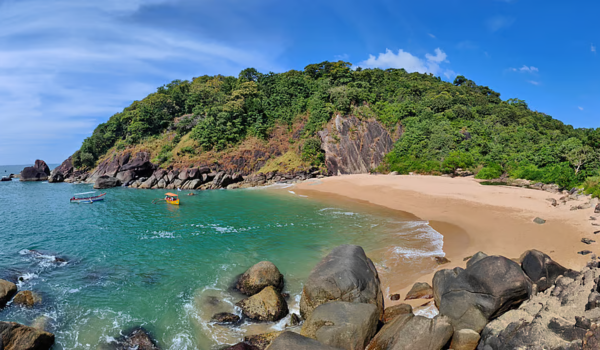 Scenic view of Butterfly Beach in Goa with cliffs and turquoise waters